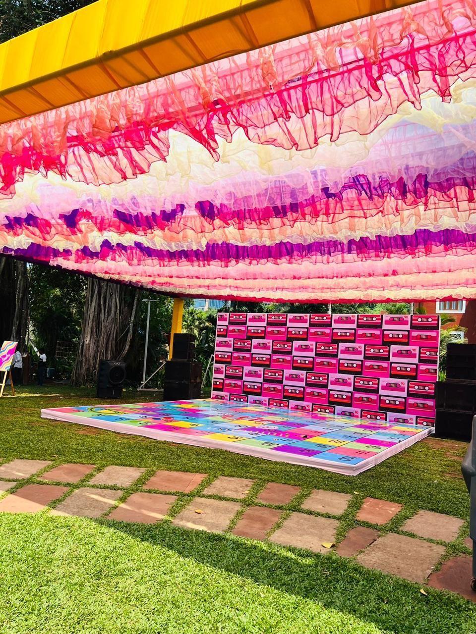 Vibrant and colorful Mehendi ceremony decorations.